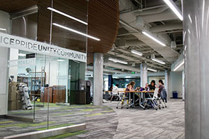 A view of the glass wall and collaboration spaces within the Center for Intercultural Engagement (CIE)