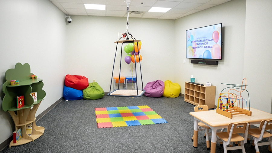 Lisa Higgins Hussman Pediatric Playroom at Loyola Clinical Center featuring small table and chairs and other pediatric play equipment