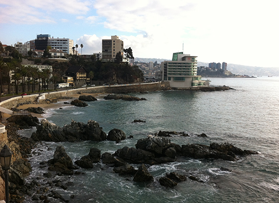 Coastal city with seaside rocks.