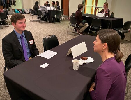 Kristin Monopolis, Associate Director and Actuary, Aon speaking with a student at the 2019 Career Night