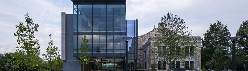 The glass facade of Loyola's Fernandez Center, and Beatty Hall