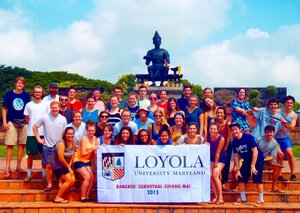 Image of a group of students with Loyola banner in front.