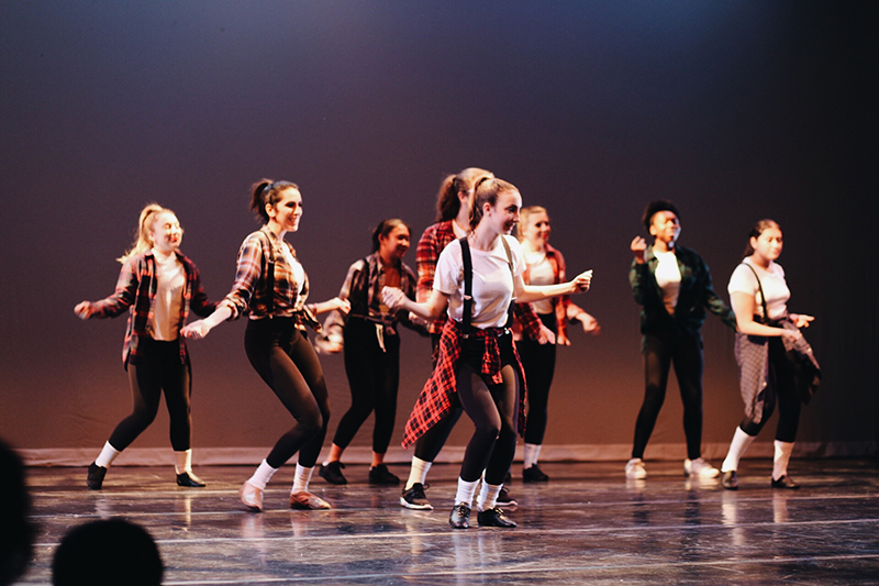 Dance Company members performing on stage