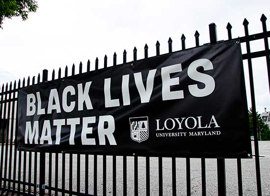 Black Loyola banner reading 