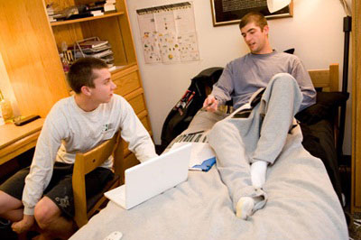 Two students talking in a Hopkins dorm room