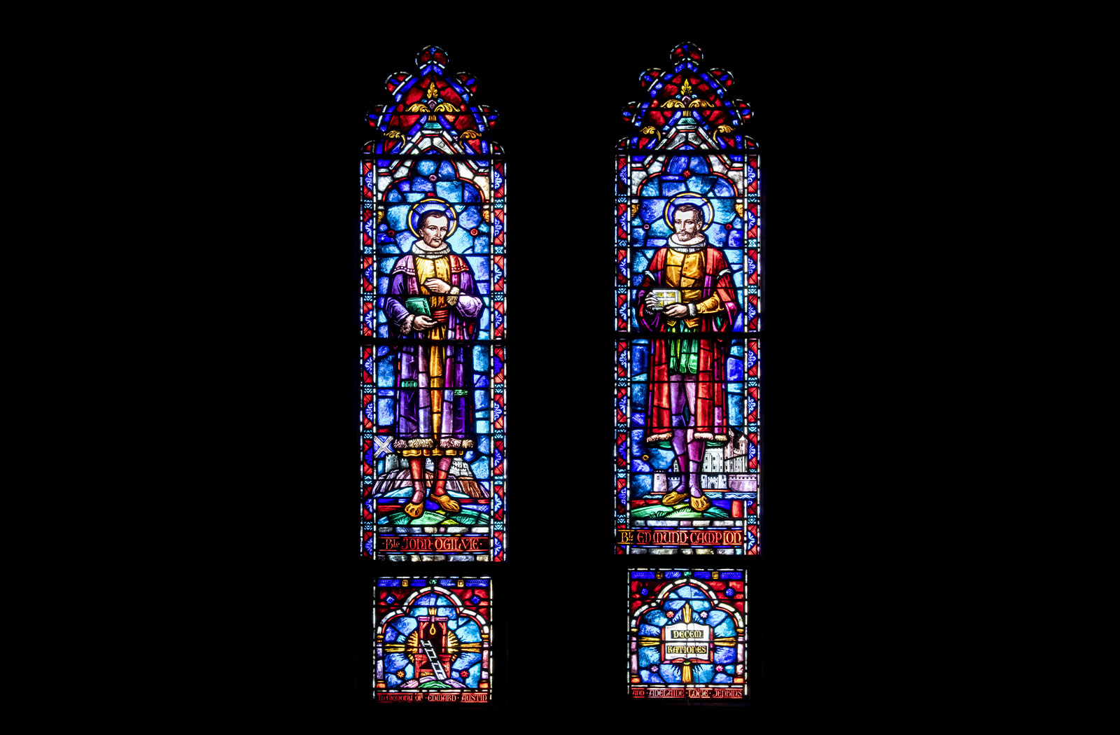 Two colorful stained glass panels of Blessed John Ogilvie and Blessed Edmund Campion