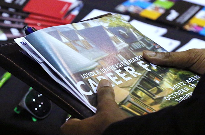 Student with a career fair booklet