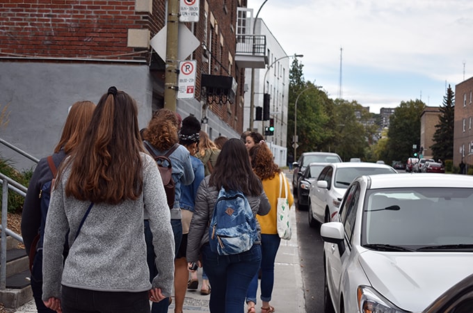 Loyola students walking down a city street in Montreal