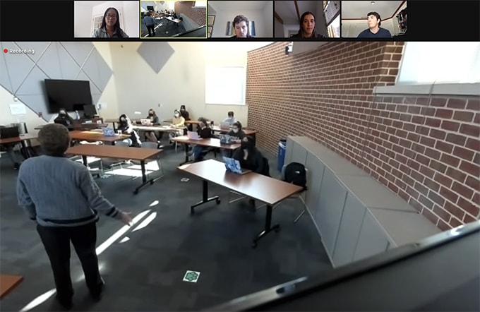 Screenshot of a classroom and students virtually attending a class on Zoom