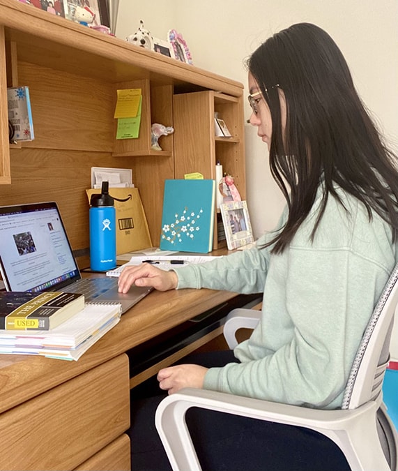 Loyola student Michelle Tran works on her laptop from her home in New Jersey