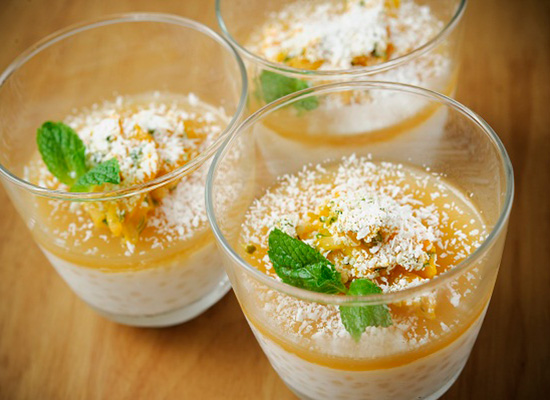 Three tropical fruit passats garnished with mint leaves.