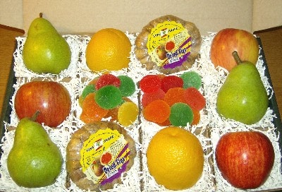 Collection of fruits and snacks in a gift box