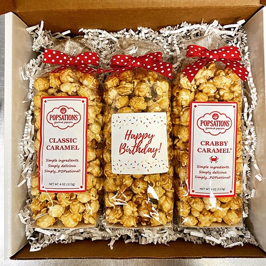 Various flavor bags of popcorn in a gift box