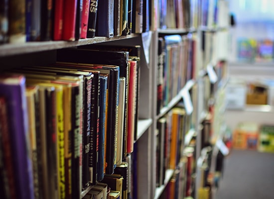 Multiple rows of shelves holding library books