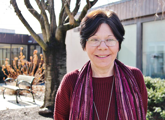 Photo of Gayle Cicero with tree in the background.