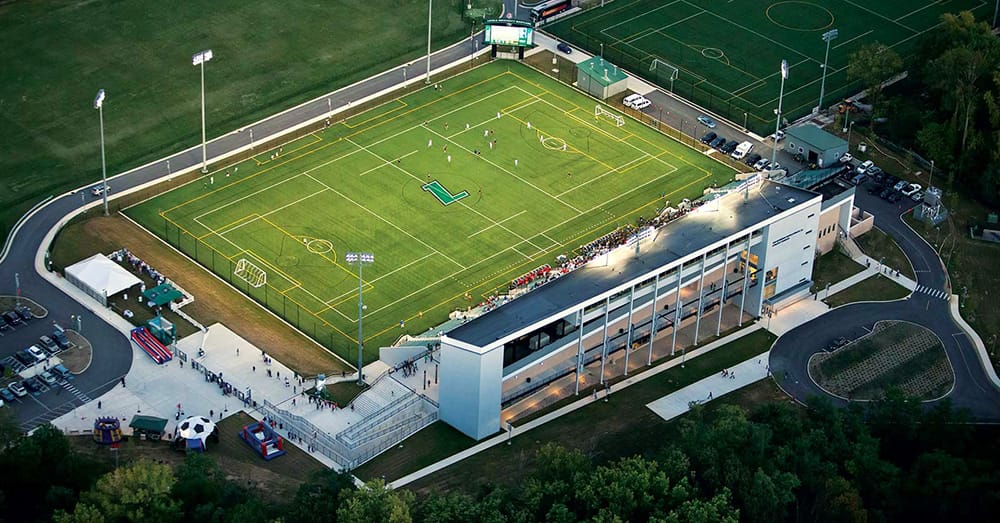 An aerial shot of the Ridley Athletic Complex, with players on the field and a full crowd