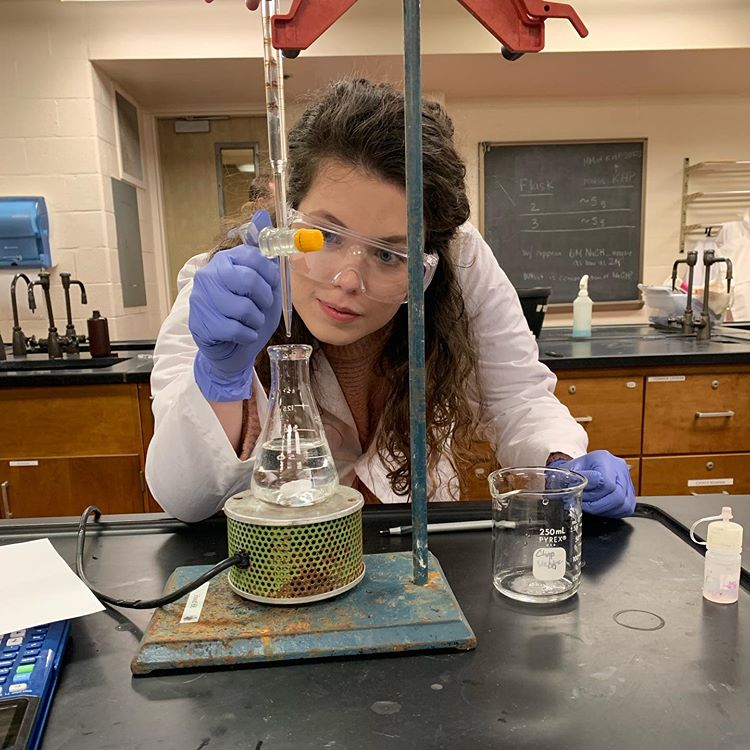 Marin, a chemistry major and mathematics minor, conducting an experiment in the lab.