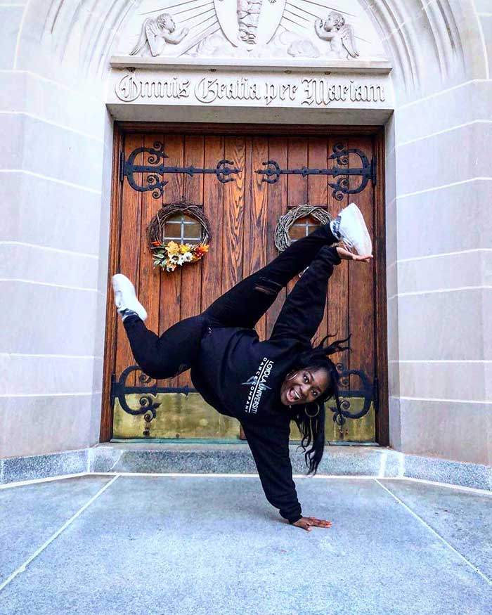 A Loyola dancer striking a one-handed pose