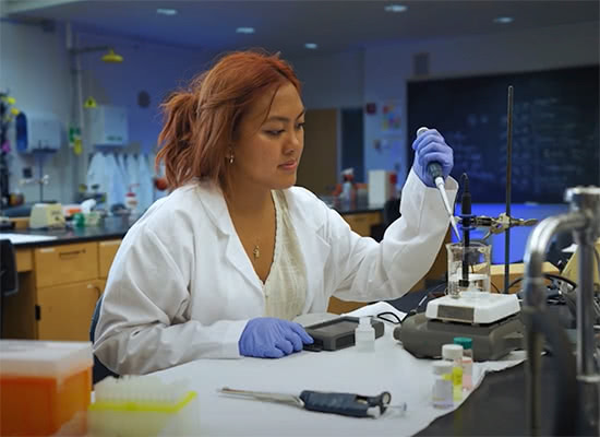 A female student working in a science lab
