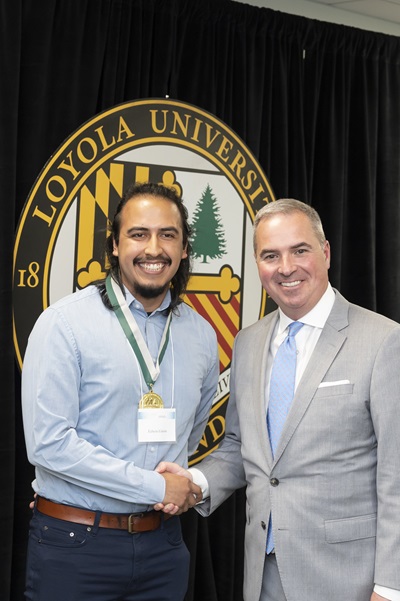 President Sawyer poses with awardee at Emerging Scholars Loyola University 2023