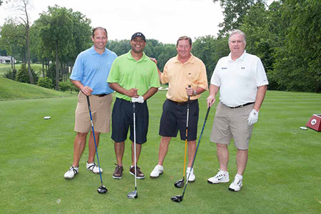 A group plays at the Golf Invitational