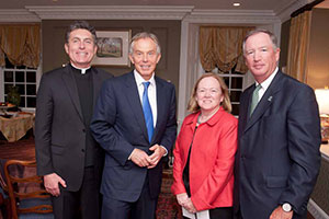 Rev. Brian Linnane, S.J., president of Loyola University Maryland, Mr. Blair, and Ed and Ellen Hanway at a private reception at the President’s residence