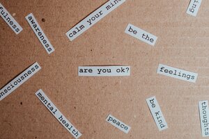 cork board with different mental health words