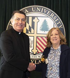 Jane Rau, who celebrated 30 years at Loyola during Maryland Day in March 2019, pictured with Loyola University Maryland President Father Brian F. Linnane, S.J.