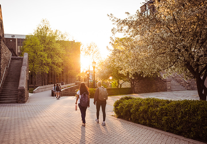 Students walking near the Sellinger building on Loyola's Evergreen campus