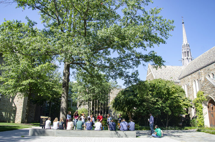 Loyola students enjoy the warm weather during a class outside