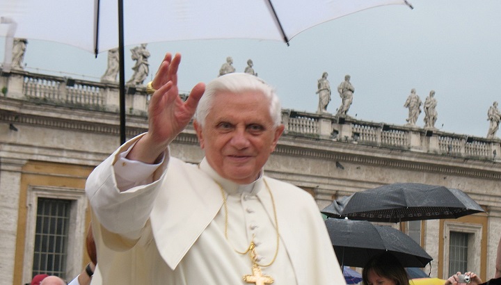 Pope Benedict XVI waves to a crowd in St. Peter's Square