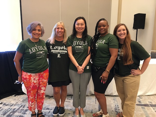 Stephanie Flores-Koulish, Lisa Schoenbrodt, Qi Shi, Rashawna Sydnor, and Leah Saal in Loyola University Maryland t-shirts