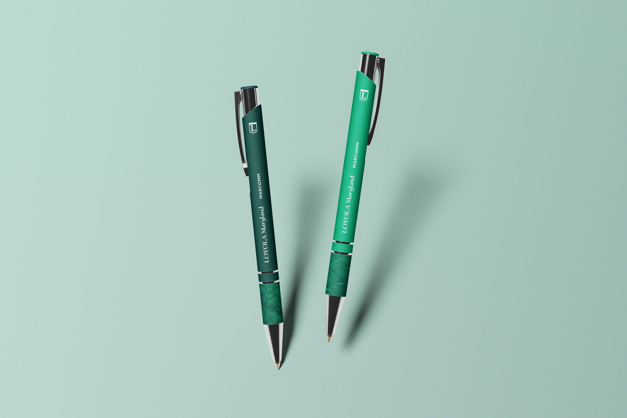 Pens with Loyola Maryland wordmark and monogram seem to float in mid air.