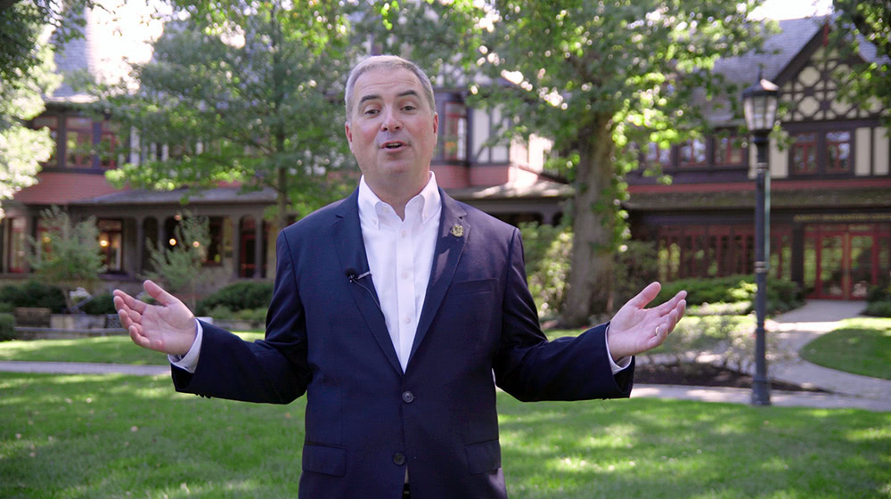 A still from the video showing Terrence Sawyer speaking in front of the Humanities building - Press enter to play