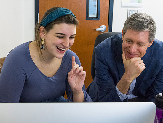 Dr. Atticks of Apprentice House Press meets with Loyola student during class