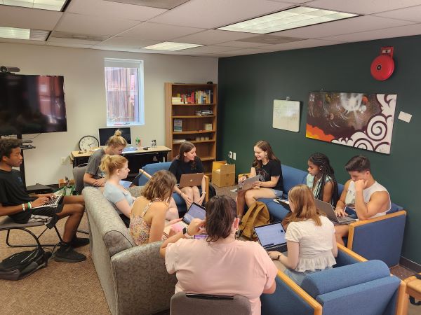 Greyhound News editors meetin in the newsroom to discuss to dicuss coverage for the upcoming week