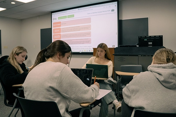 students working in groups in a classroom