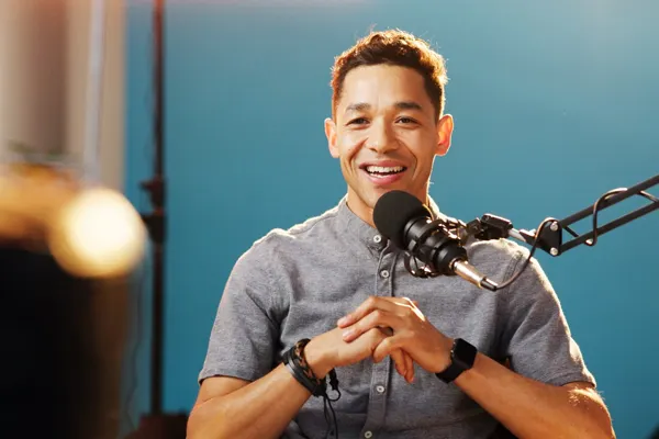A student talking into a microphone