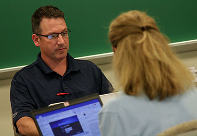 A faculty member and student working