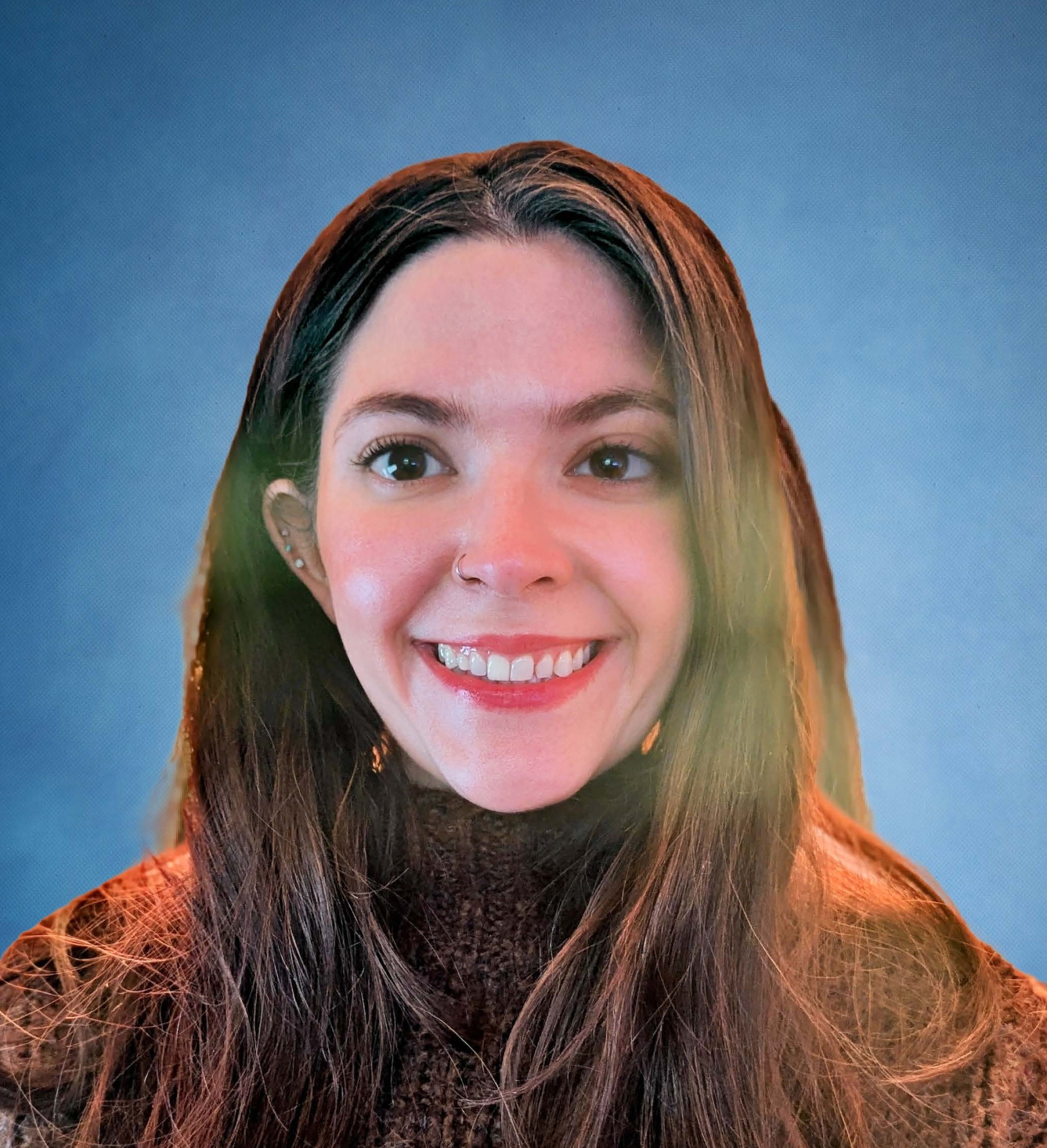 Jillian Dupuis headshot in brown sweater on blue background