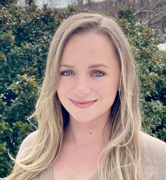 Haley Runaldue headshot in beige sweater