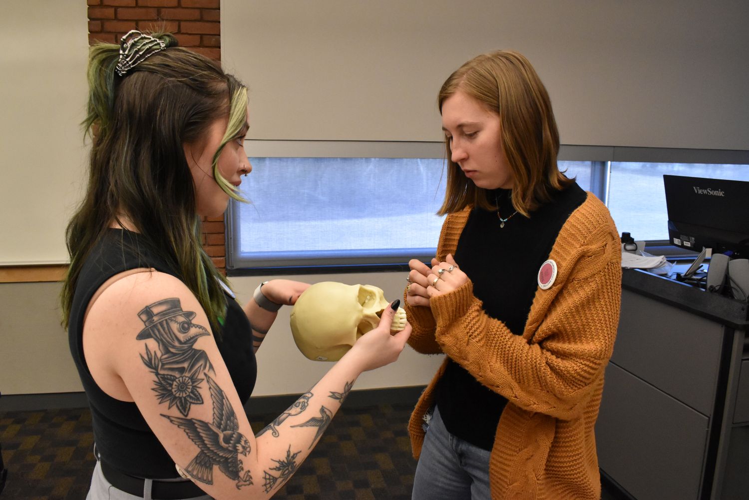 Biological forensics students examine a skull.