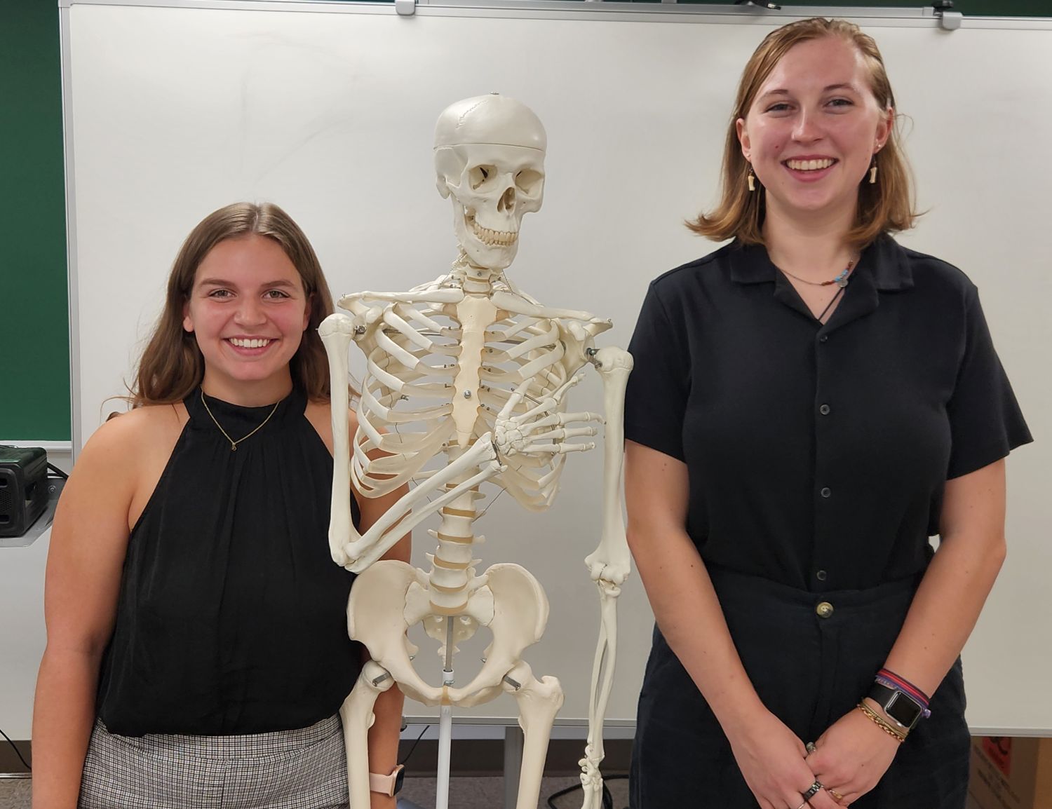 Biological forensics students with skeleton