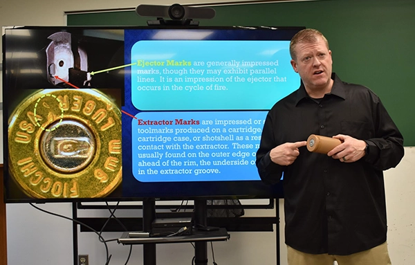 Professor works with students