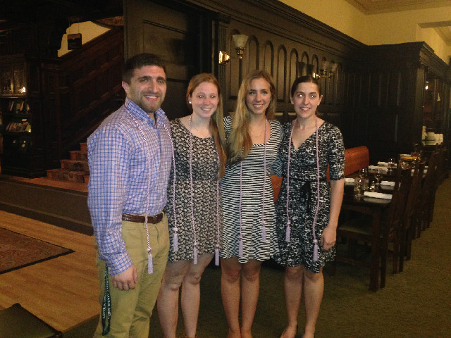 2015 tri-iota inductees wearing their graduation cords