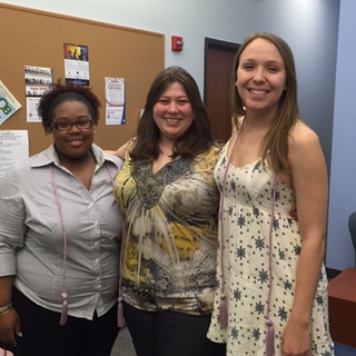 2016 tri-iota inductees wearing their graduation cords