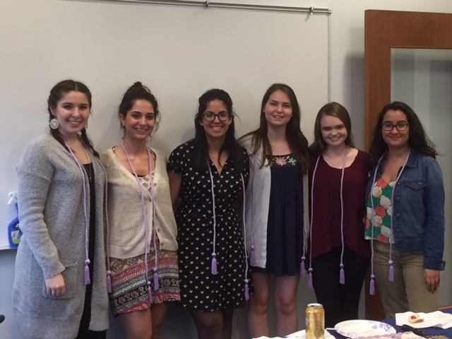 2017 tri-iota inductees wearing their graduation cords