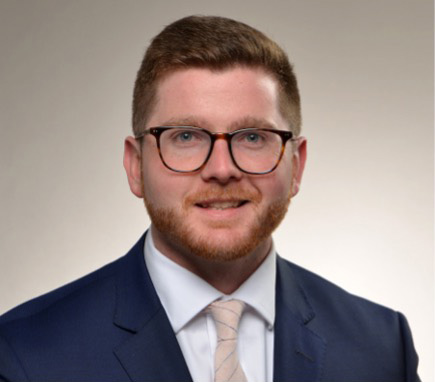 Devon De Marco in business attire