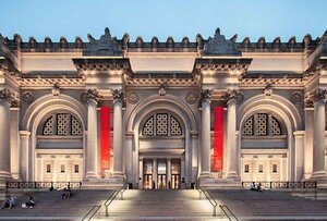 building facade at twilight with red banners