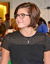 Danielle Melfi smiling at a busy event